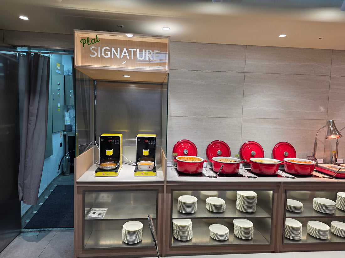 Two HAUSCOOK units installed at a commercial dining buffet station